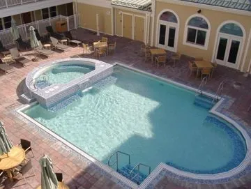 Pool With Exercise Room Behind It