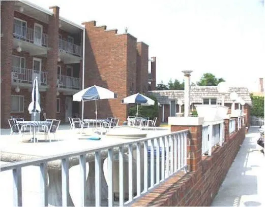 Patio with tables, chairs, and umbrellasbrellas and 
