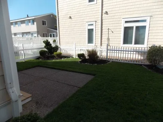 Backyard with gas grill.
