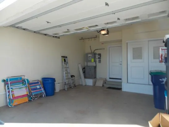 Garage with beach chairs and toys
