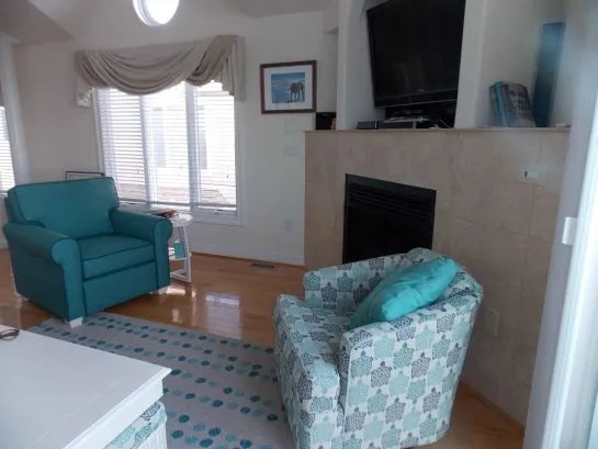 Living room 2 comfy chairs, gas fireplace