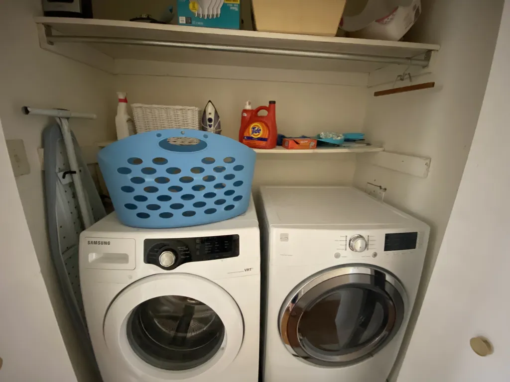Laundry closet with full size front load washer and dryer