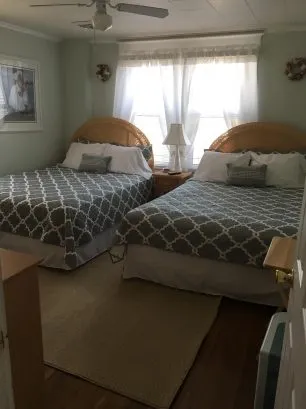 First bedroom with 2 queens and great boardwalk/ocean views as well as cable!