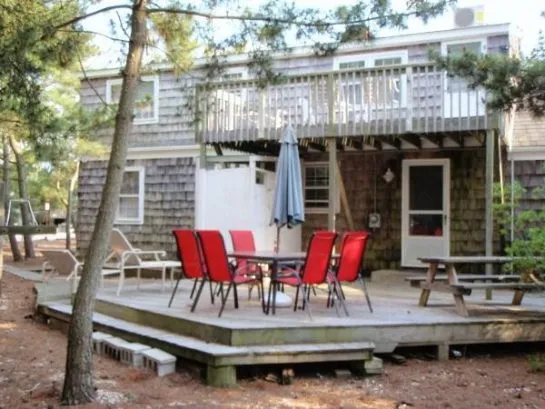 Huge deck with 2 eating area, BBQ.  Large play area adjacent to deck