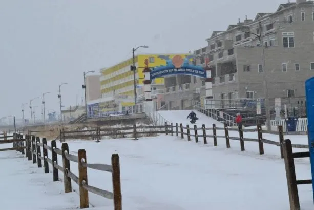 LET IT SNOW at the beach! Sledding the Boardwalk by the North Wildwood Arch!  Always FUN at our North Wildwood Heavenly Havens Oceanfront Vacation Rentals!