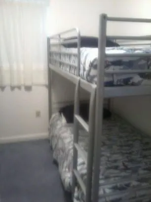 The smallest bedroom has a set of bunkbeds as well as small clos