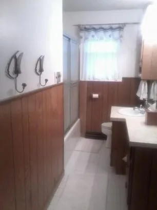 The main bathroom, which has towels and washcloths available.