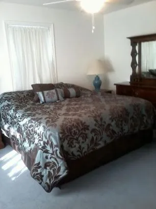The Master bedroom has a King-sized bed, large dresser, large cl