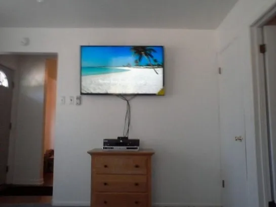 The Sitting Room Has A Flat Screen Tv.