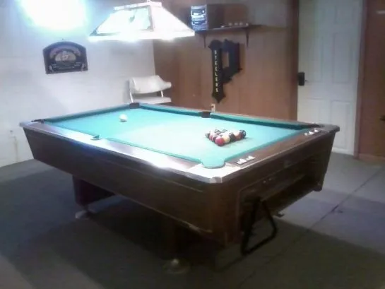 Another room in the basement has a pool table.