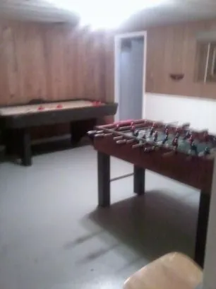 The downstairs gameroom has airhockey and foozeball tables for t