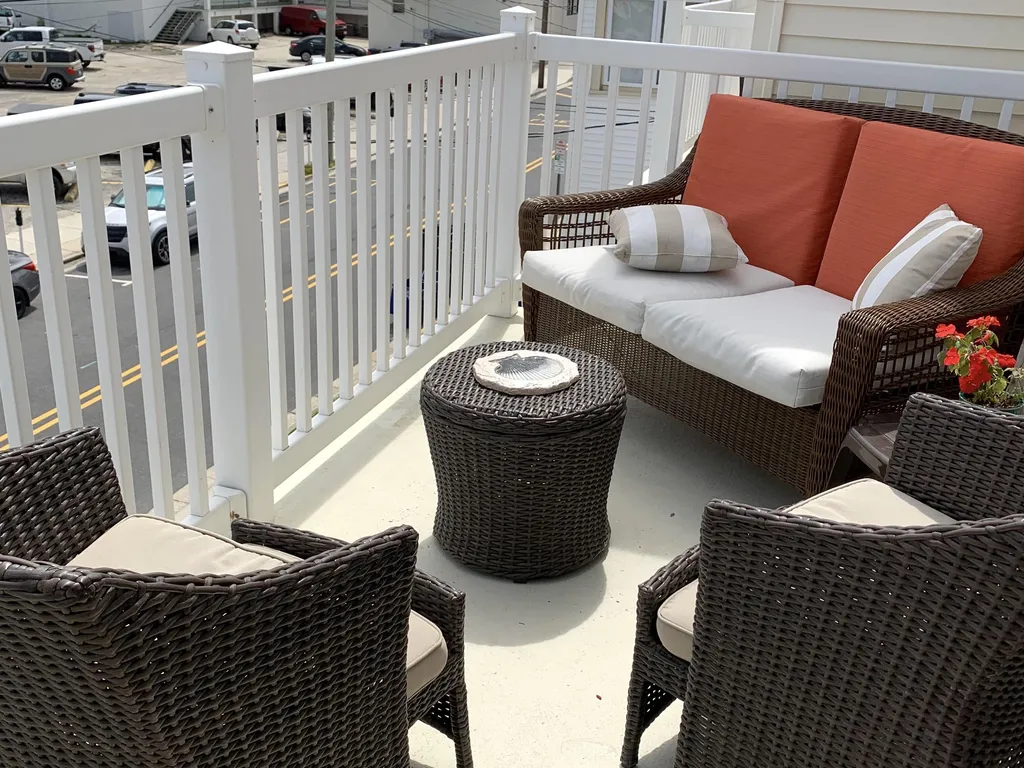 Furnished private deck with grille overlooking all the comings and goings of the Wildwoods l, steps to beach, boardwalk and piers 