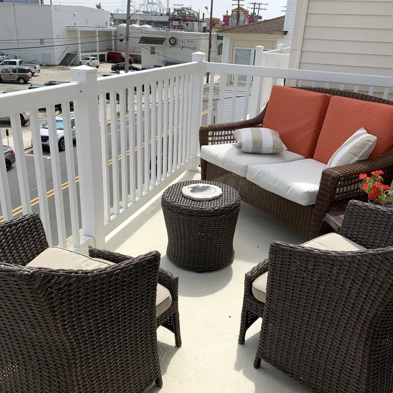 Furnished private deck with grille overlooking all the comings and goings of the Wildwoods l, steps to beach, boardwalk and piers 