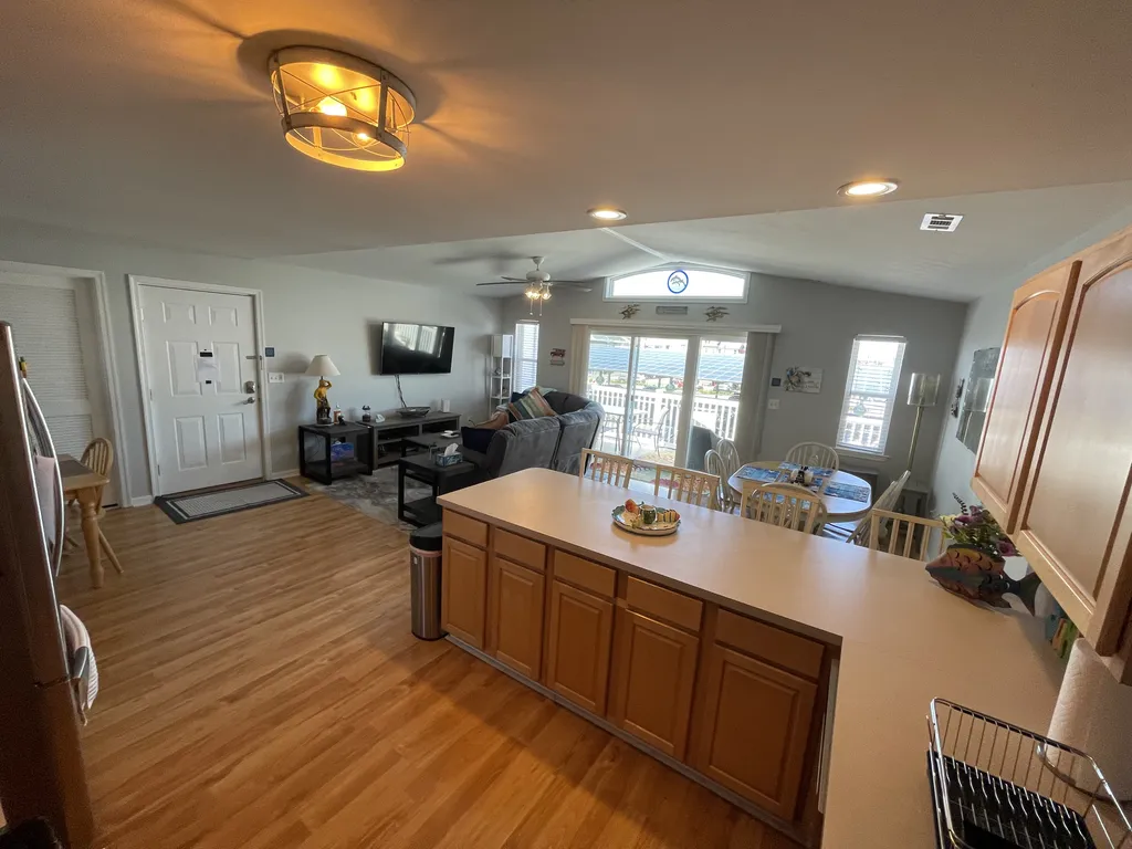 Kitchen looking towards great room, plenty of storage with additional seating for four