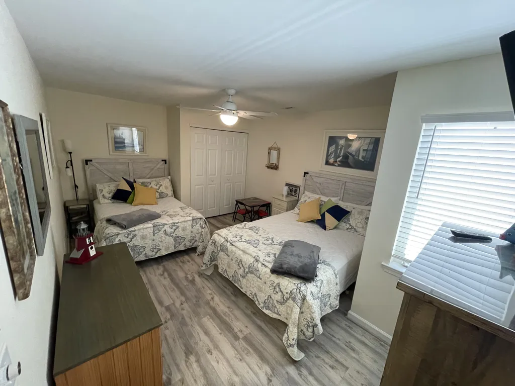 Bedroom 2, 1 queen, 1 double, large closet, flat screen, room to move, plus pack n play in closet 