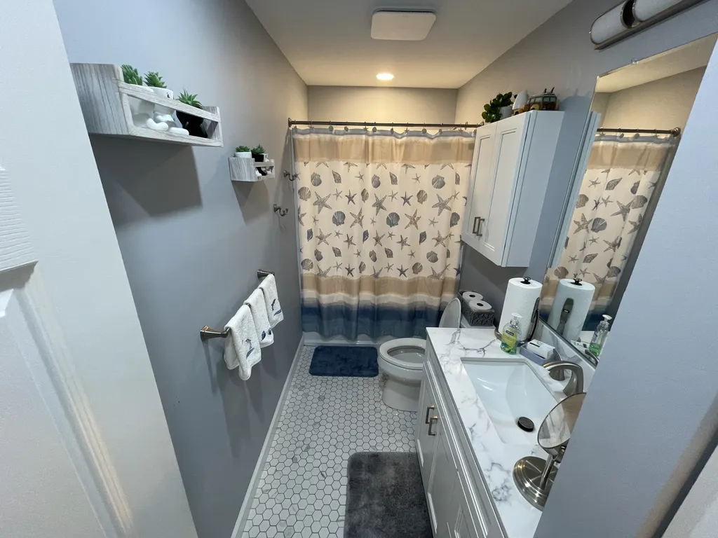 New Hall with tub, shower, extra lighting l, large vanity l, linen closet 