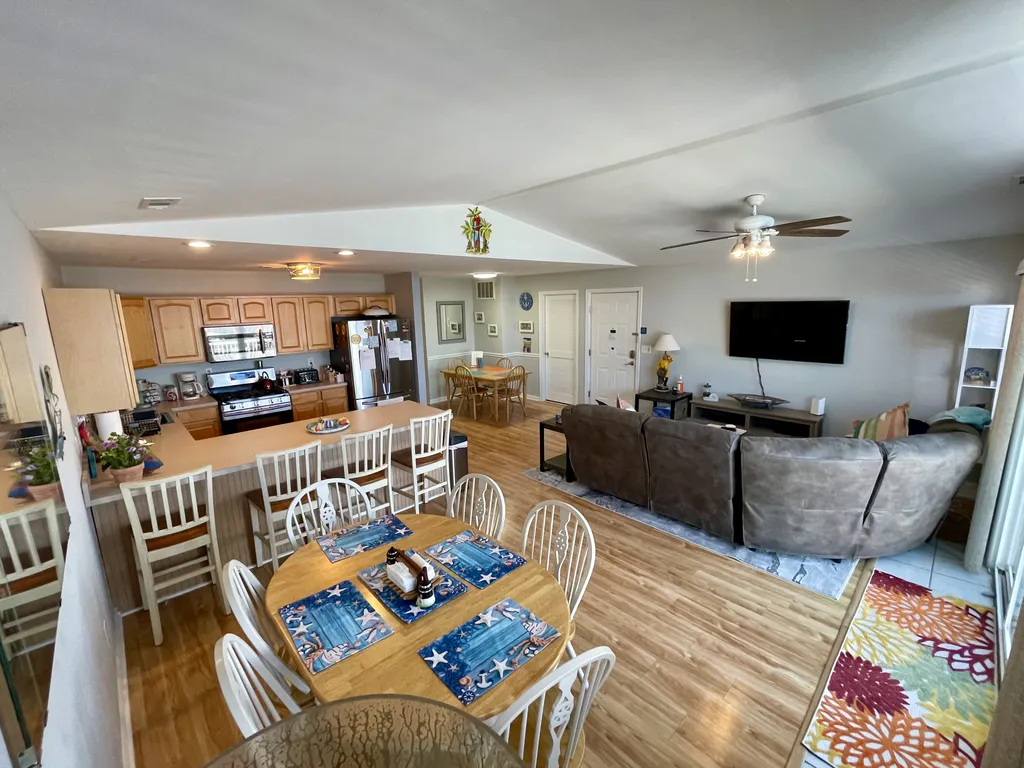 Large dining area, kitchen and seating view from the slider 