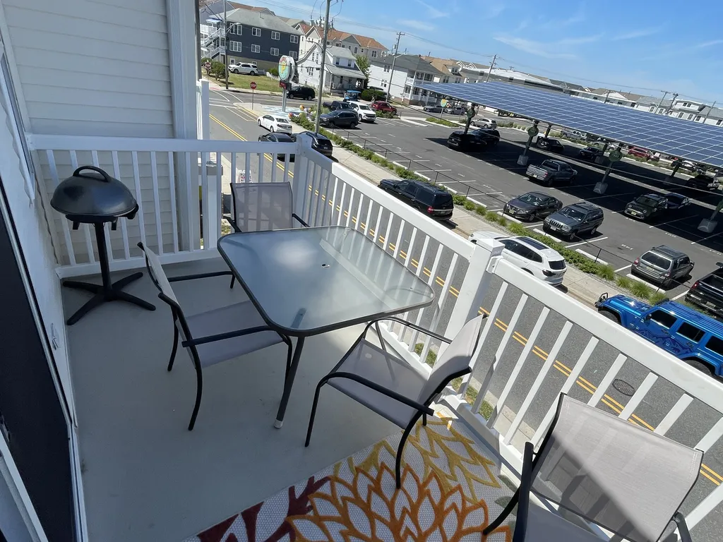 Large furnished deck with grille overlooking all the comings and goings of the Wildwoods 