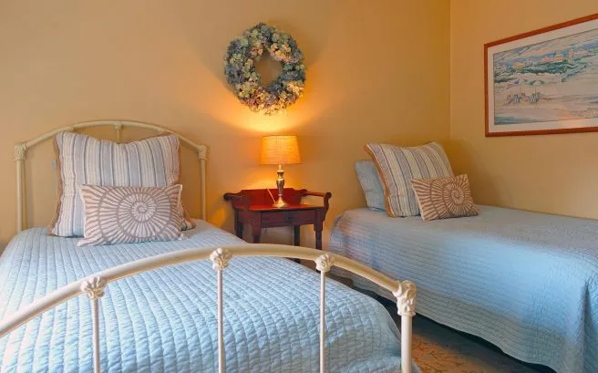 2 twin beds in second bedroom.