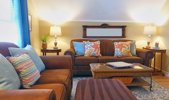 Living room is comfortably furnished for reading &amp;amp; relaxing.