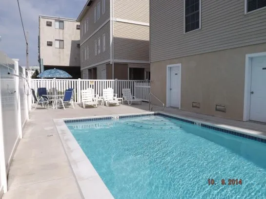 crystal clear heated pool, professionally maintained