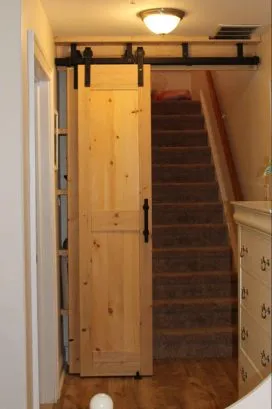Barn Doors at the entrance of the stairs leading up, from our 1st floor room.
