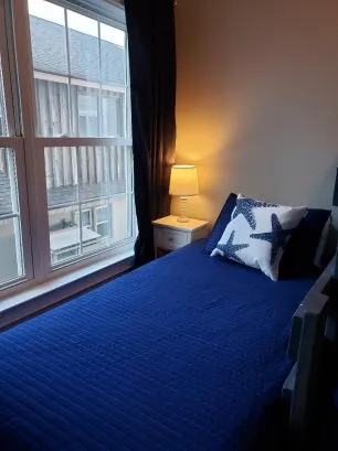 View of bunk room with the twin bed by the window.