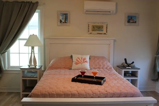 View of queen bed in first floor master.