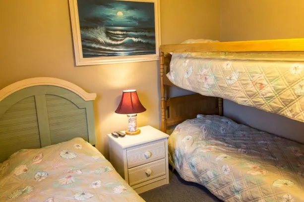 Wooden bunkbeds and single bed
