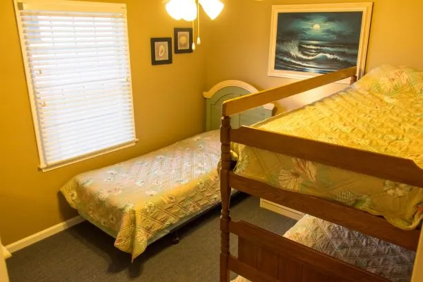 Wooden bunkbeds and single bed