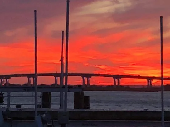 Sunset view of 9th St Bridge from bay