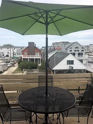 View of deck with table/chairs/grill