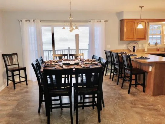 Large fully-stocked eat-in kitchen with seating for 12 guests