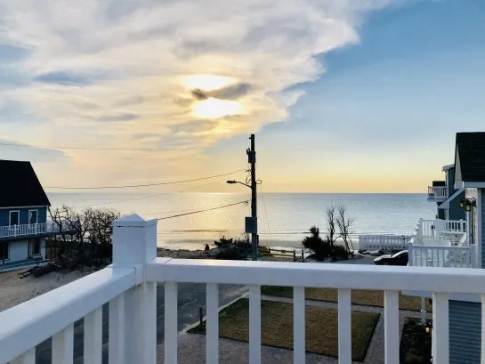 View of beach and bay from upper deck outside Master Bedroom