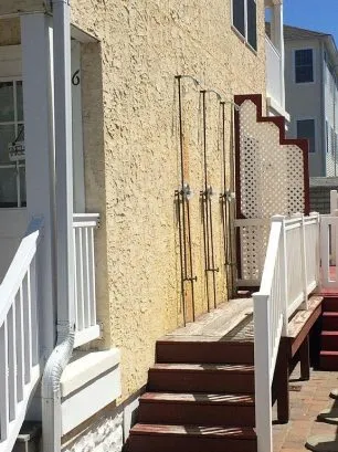Showers behind townhome