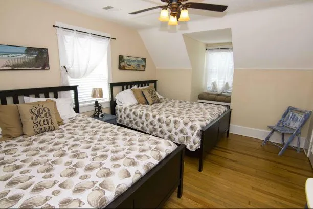 Spacious upstairs bedroom with 2 queen sized beds