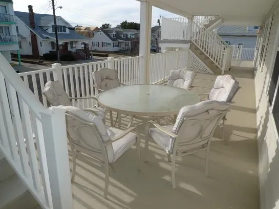 Covered deck is the perfect spot for morning coffee, people watching, or fireworks!