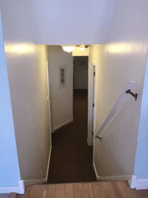 A few steps down from the main living area leads to a quiet level for the bedrooms and bathrooms