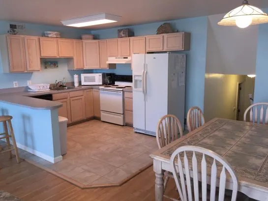 Fully stocked kitchen with drip coffeemaker, microwave, blender, etc.