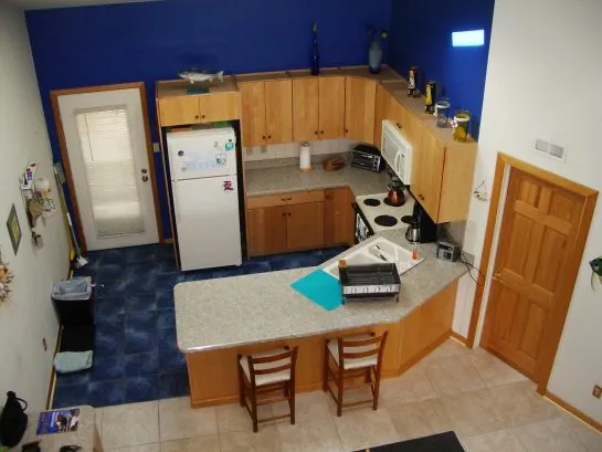 View of kitchen from spiral staircase