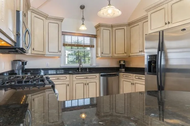 Kitchen overlooks privat pool and great room