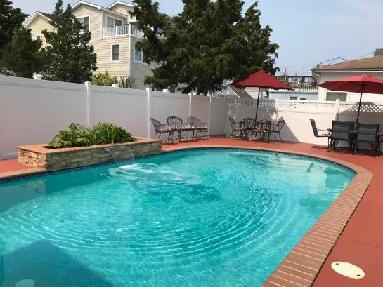 Fully fenced pool with entrance from both sides of the home