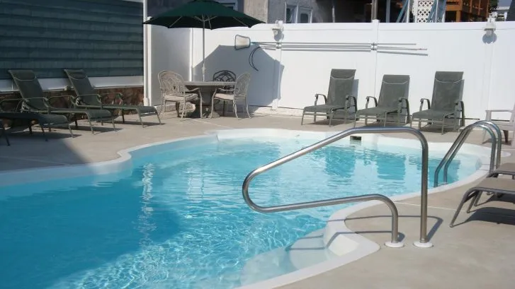 The heated pool and surrounding patio.  Swim, Grill, Eat &amp;amp; Relax!
