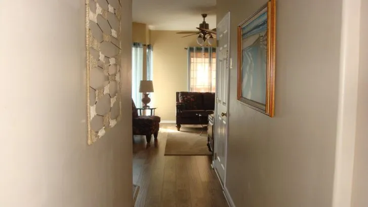 Hallway leading away from bedrooms to living spaces.