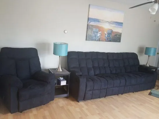 living room with reclining seats for 5