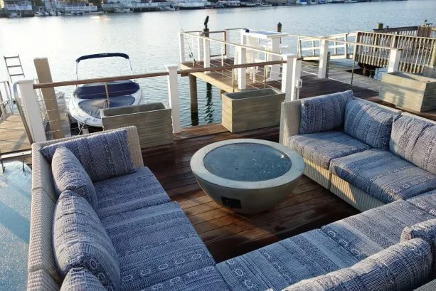 Comfortable deep seating on lower deck level provides luxurious sunning space by day, and a cozy space for cocktails and talking around the fire in the evening.
