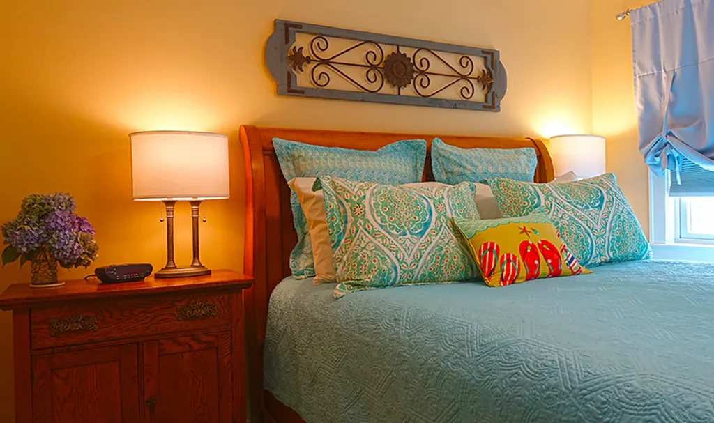 Queen sleigh bed in the primary bedroom.