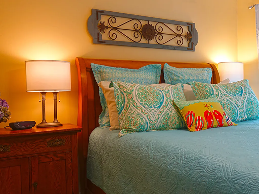 Queen sleigh bed in the primary bedroom.