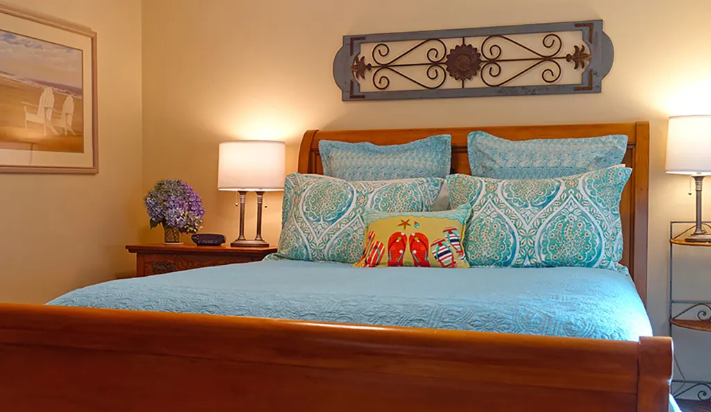 Queen sleigh bed in the primary bedroom.