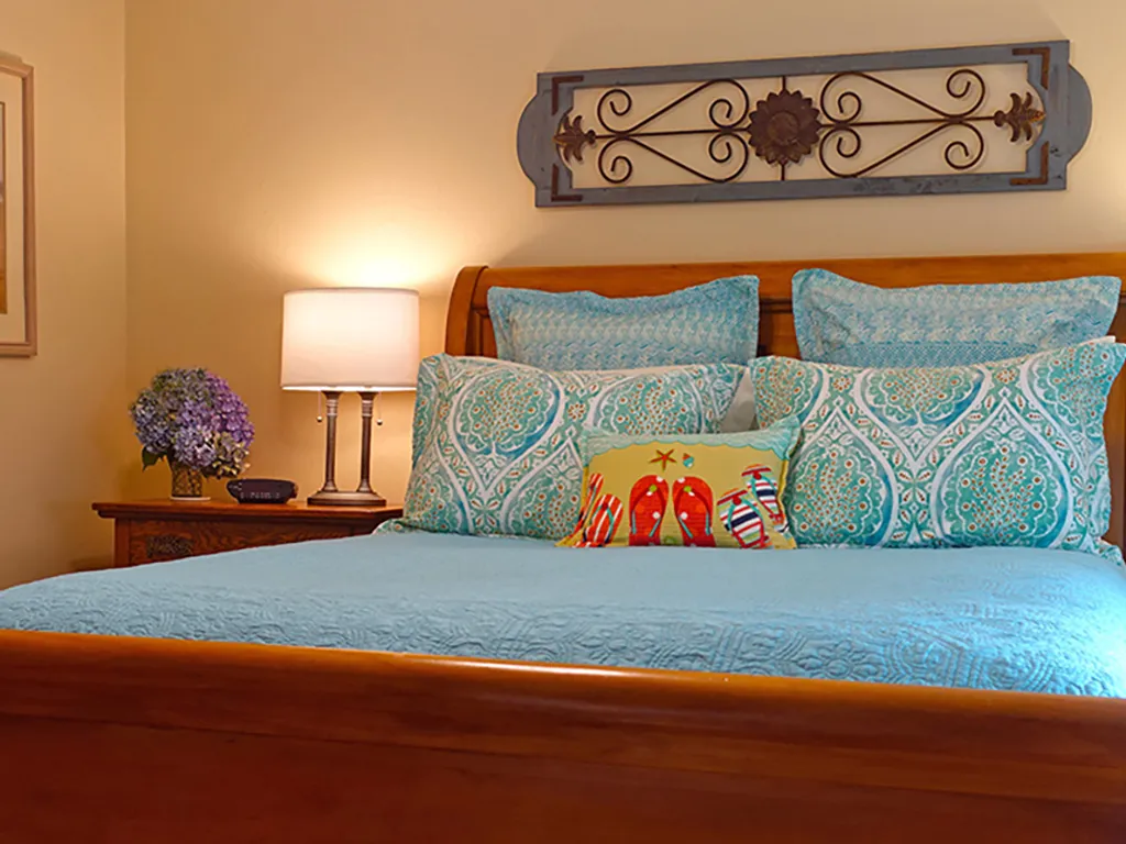 Queen sleigh bed in the primary bedroom.
